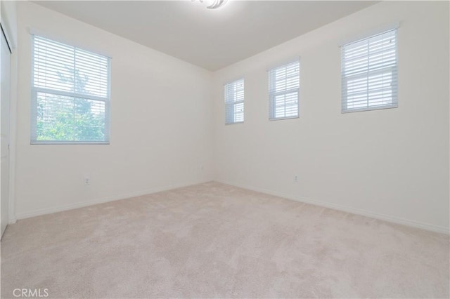 1504 Granada Rd, Upland, CA 91786 - spare room featuring light carpet and baseboards