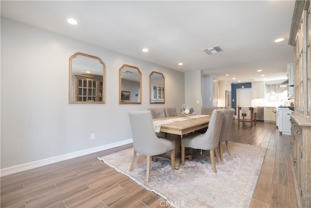 712 Buckingham Dr, Redlands, CA 92374 - dining room featuring wood finished floors and recessed lighting