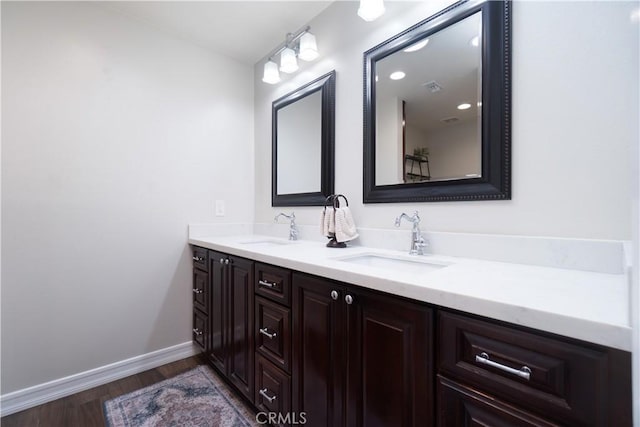 712 Buckingham Dr, Redlands, CA 92374 - full bath with wood finished floors and double vanity