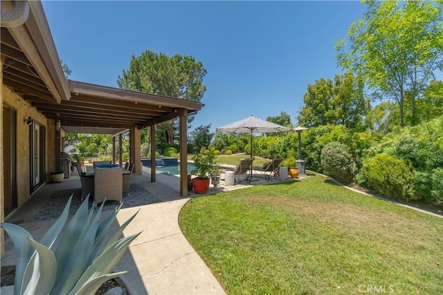 712 Buckingham Dr, Redlands, CA 92374 - view of grassy yard with a patio and an outdoor pool
