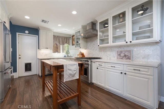 712 Buckingham Dr, Redlands, CA 92374 - kitchen featuring high quality appliances, wall chimney range hood, white cabinets, light countertops, and recessed lighting