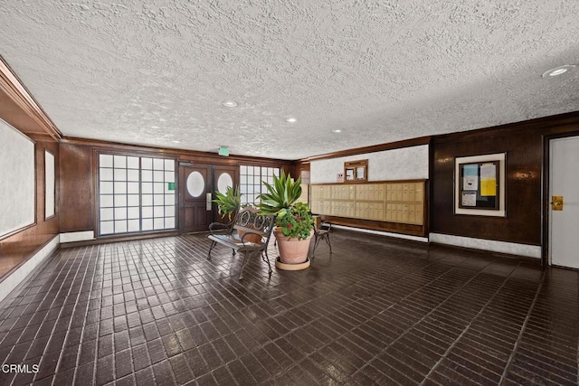 360 S Euclid Ave Unit 124, Pasadena, CA 91101 - lobby with ornamental molding, a textured ceiling, and wood walls