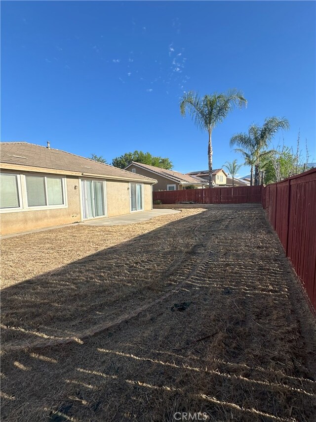 1256 Sunburst Dr, Beaumont, CA 92223 - fenced backyard featuring a patio