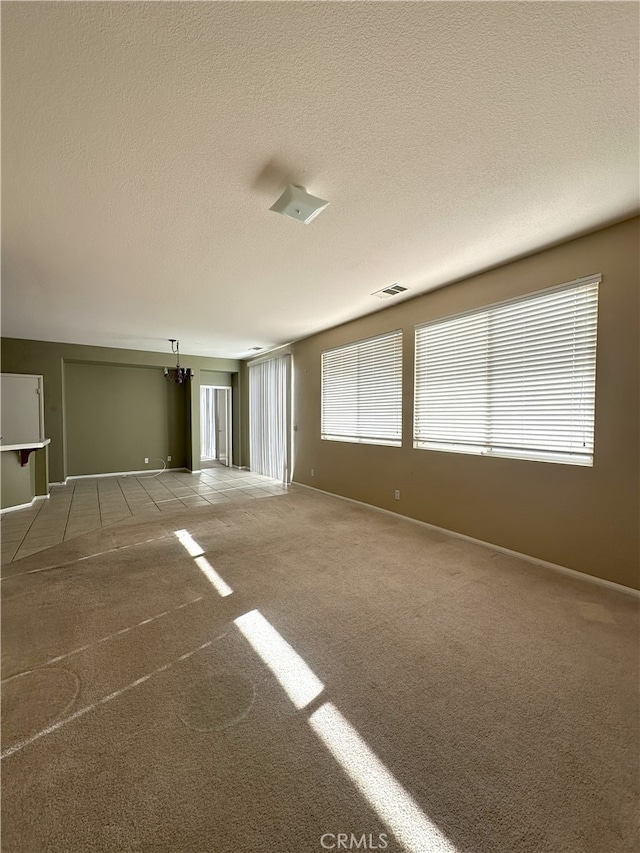 1256 Sunburst Dr, Beaumont, CA 92223 - spare room featuring carpet and a textured ceiling