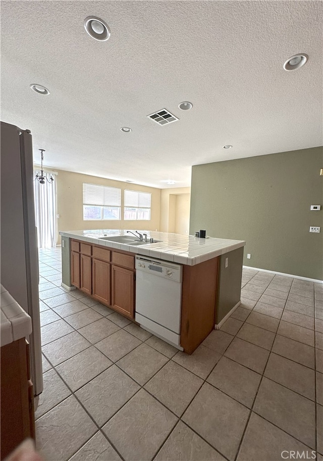 1256 Sunburst Dr, Beaumont, CA 92223 - kitchen with white appliances, tile countertops, a textured ceiling, recessed lighting, and light tile patterned flooring
