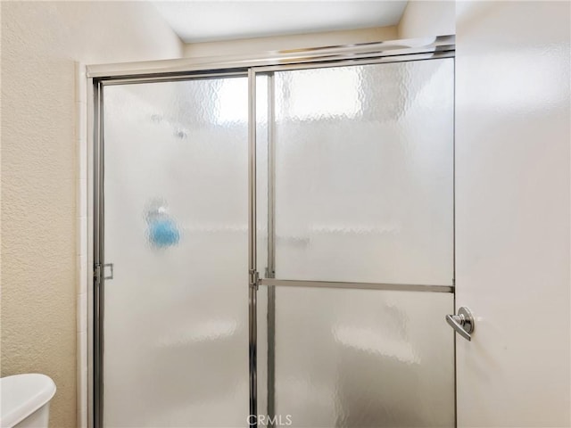 16873 Silica Dr, Victorville, CA 92395 - full bathroom featuring a shower with door and toilet