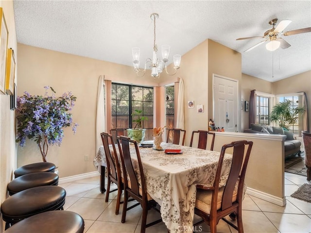 16873 Silica Dr, Victorville, CA 92395 - dining room with a textured ceiling, light tile patterned floors, a ceiling fan, and a chandelier