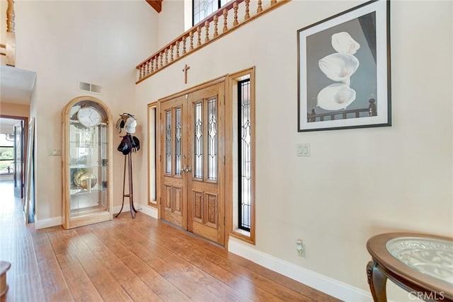 1013 Idaho Ct, Claremont, CA 91711 - entryway with wood-type flooring and a high ceiling