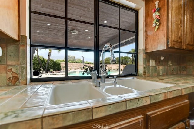 1013 Idaho Ct, Claremont, CA 91711 - kitchen featuring brown cabinets and tasteful backsplash