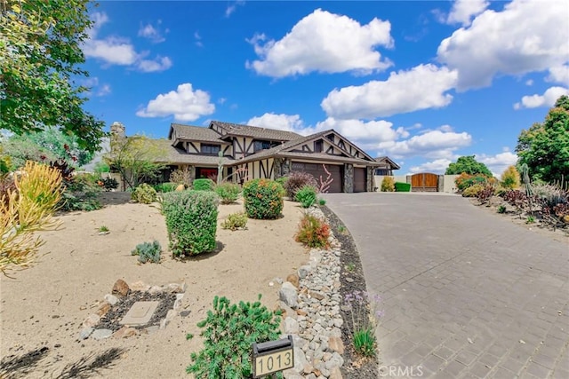1013 Idaho Ct, Claremont, CA 91711 - view of front of home with an attached garage, a gate, decorative driveway, and stucco siding