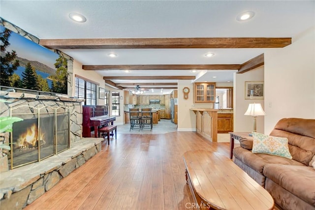 1013 Idaho Ct, Claremont, CA 91711 - living room featuring a fireplace, recessed lighting, light wood-style flooring, ceiling fan, and beam ceiling