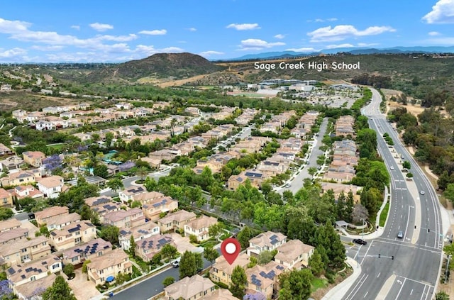 3651 Summit Trail Ct, Carlsbad, CA 92010 - aerial overview of property's location with nearby suburban area and a mountain backdrop