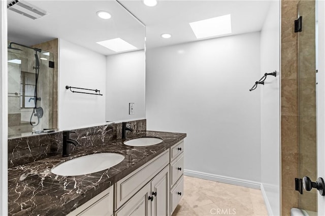 2610 Via Pacheco, Palos Verdes Estates, CA 90274 - full bath featuring a skylight, double vanity, a shower stall, recessed lighting, and tile patterned flooring