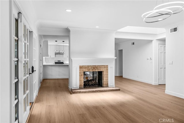 2610 Via Pacheco, Palos Verdes Estates, CA 90274 - unfurnished living room with ornamental molding, wood finished floors, a chandelier, recessed lighting, and a fireplace