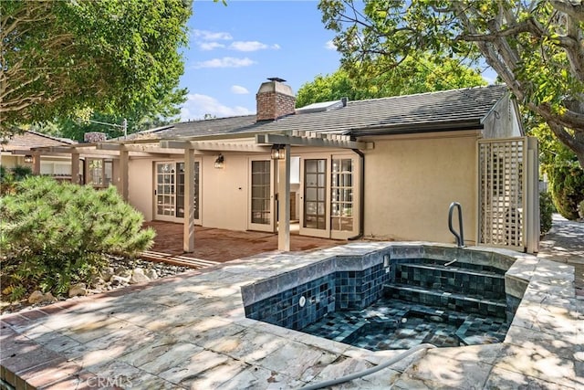 2610 Via Pacheco, Palos Verdes Estates, CA 90274 - back of house featuring french doors, a chimney, and stucco siding