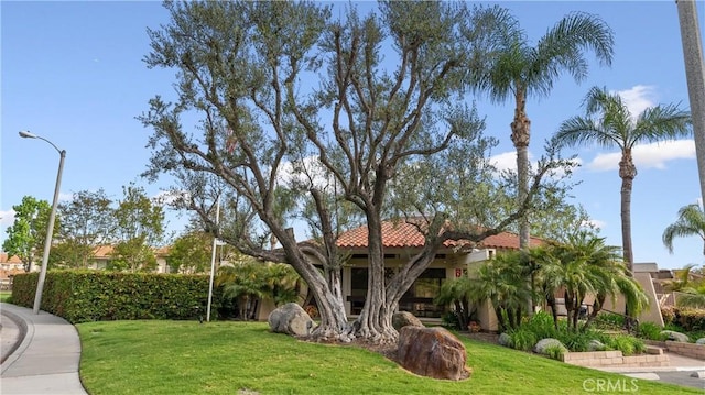 532 Riviera Ct, Fullerton, CA 92835 - view of front of home featuring a front yard, a tiled roof, and stucco siding