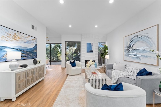 532 Riviera Ct, Fullerton, CA 92835 - living room with light wood-style floors, recessed lighting, and a fireplace