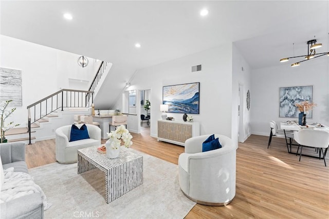 532 Riviera Ct, Fullerton, CA 92835 - living area with stairs, light wood-style flooring, recessed lighting, and a chandelier