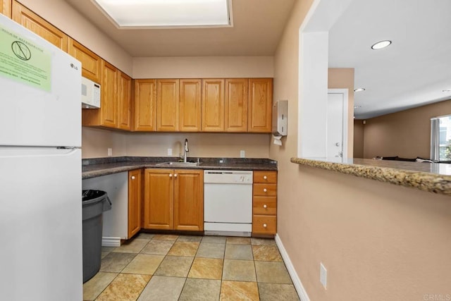 13323 Rancho Penasquitos Blvd Unit D206, San Diego, CA 92129 - kitchen with white appliances, recessed lighting, and dark stone counters