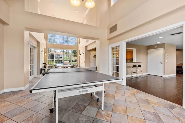 13323 Rancho Penasquitos Blvd Unit D206, San Diego, CA 92129 - rec room with a towering ceiling and baseboards