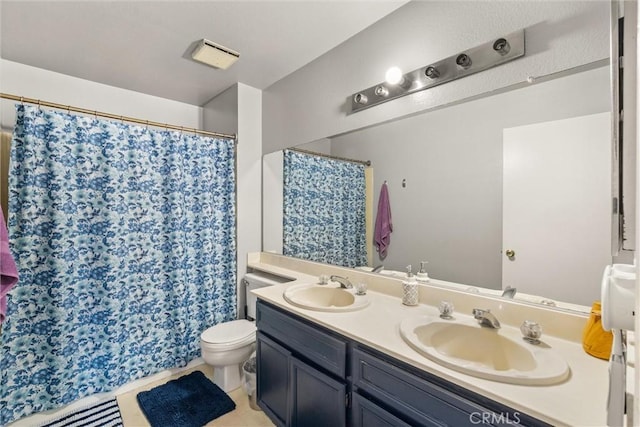 9765 Alburtis Ave Unit 143, Santa Fe Springs, CA 90670 - full bath featuring double vanity, a shower with curtain, and tile patterned flooring