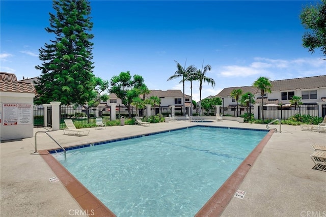 9765 Alburtis Ave Unit 143, Santa Fe Springs, CA 90670 - community pool featuring a patio area and a residential view