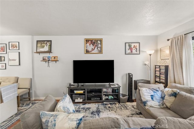 9765 Alburtis Ave Unit 143, Santa Fe Springs, CA 90670 - living area featuring a textured ceiling and baseboards