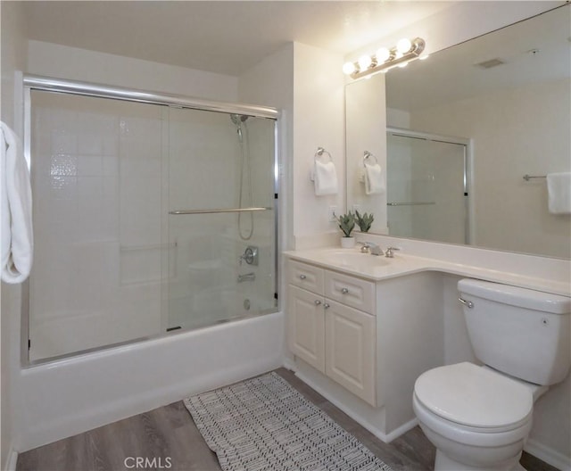 1281 Cabrillo Ave Unit 303, Torrance, CA 90501 - bathroom featuring vanity, combined bath / shower with glass door, and wood finished floors