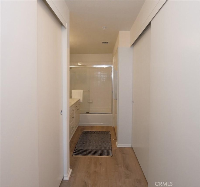 1281 Cabrillo Ave Unit 303, Torrance, CA 90501 - hallway featuring wood finished floors and baseboards