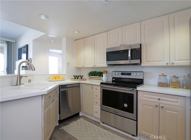1281 Cabrillo Ave Unit 303, Torrance, CA 90501 - kitchen with appliances with stainless steel finishes, plenty of natural light, white cabinetry, and recessed lighting