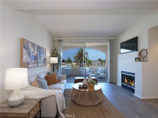 1281 Cabrillo Ave Unit 303, Torrance, CA 90501 - living area with wood finished floors and a glass covered fireplace