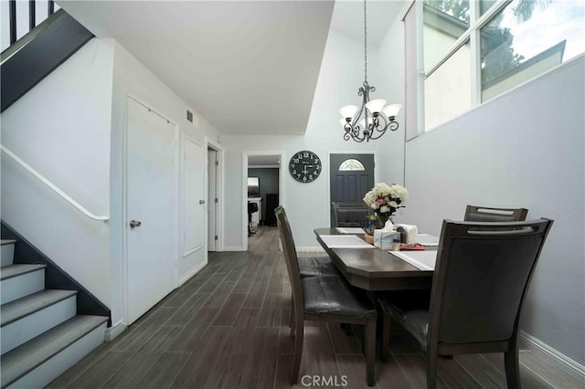 1320 Cabrillo Park Dr Unit D, Santa Ana, CA 92701 - dining area with a chandelier, stairs, and dark wood-style flooring