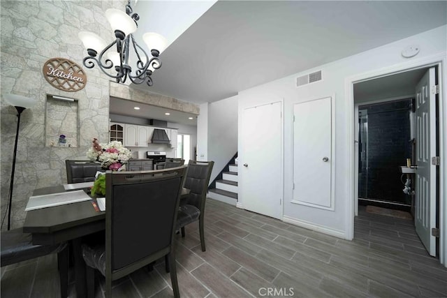 1320 Cabrillo Park Dr Unit D, Santa Ana, CA 92701 - dining room with a chandelier, stairway, and dark wood finished floors