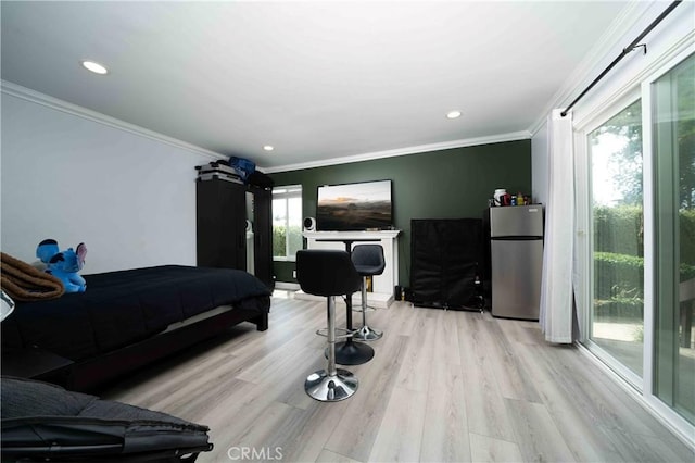 1320 Cabrillo Park Dr Unit D, Santa Ana, CA 92701 - bedroom featuring freestanding refrigerator, light wood-style flooring, crown molding, access to outside, and recessed lighting