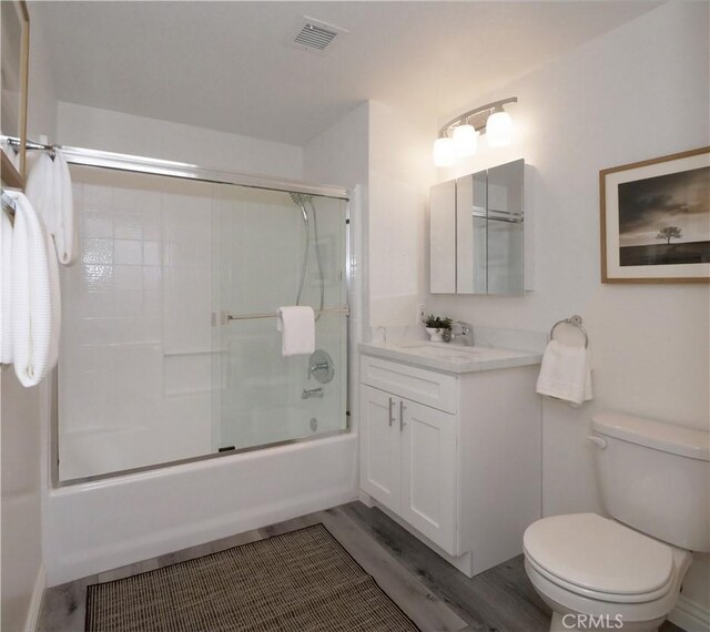 1281 Cabrillo Ave Unit 306, Torrance, CA 90501 - bathroom with vanity, enclosed tub / shower combo, and wood finished floors