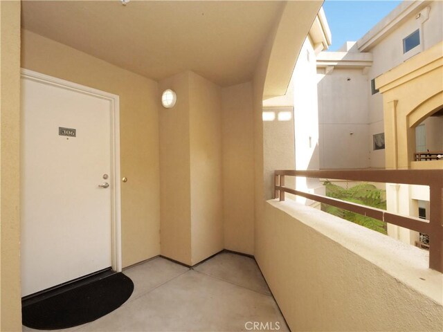 1281 Cabrillo Ave Unit 306, Torrance, CA 90501 - property entrance with a balcony and stucco siding