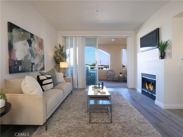 1281 Cabrillo Ave Unit 306, Torrance, CA 90501 - living area with wood finished floors and a fireplace