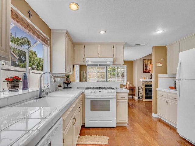 2756 Lemon Dr, Simi Valley, CA 93063 - kitchen featuring white appliances, tile countertops, decorative backsplash, under cabinet range hood, and recessed lighting