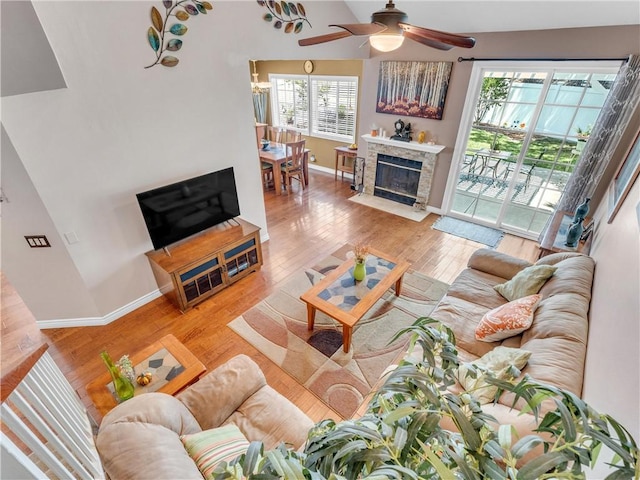 2756 Lemon Dr, Simi Valley, CA 93063 - living room with a ceiling fan, wood finished floors, and a fireplace with flush hearth