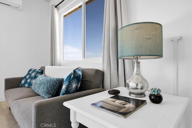 74697 Baseline Rd Unit 29, Palms, CA 92277 - living area with an AC wall unit and wood finished floors
