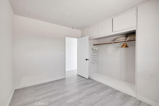 74697 Baseline Rd Unit 29, Palms, CA 92277 - unfurnished bedroom featuring a closet and baseboards
