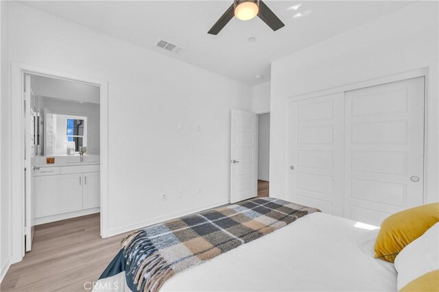 208 Harringay, Irvine, CA 92618 - bedroom featuring light wood-style flooring, a closet, connected bathroom, and ceiling fan