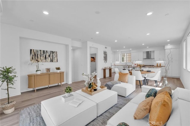 208 Harringay, Irvine, CA 92618 - living room with light wood finished floors and recessed lighting