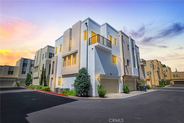 208 Harringay, Irvine, CA 92618 - property at dusk with a residential view and a garage