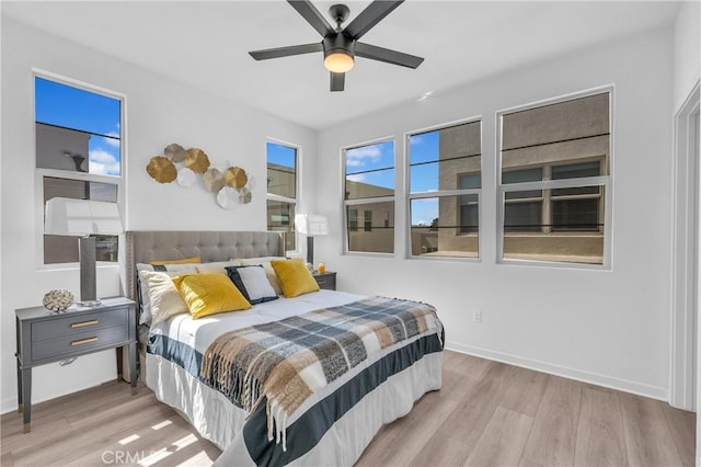 208 Harringay, Irvine, CA 92618 - bedroom with light wood-style floors and a ceiling fan