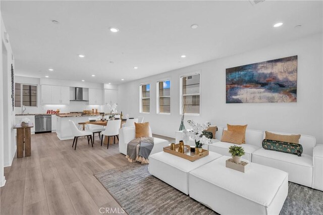 208 Harringay, Irvine, CA 92618 - living area featuring recessed lighting and light wood-type flooring