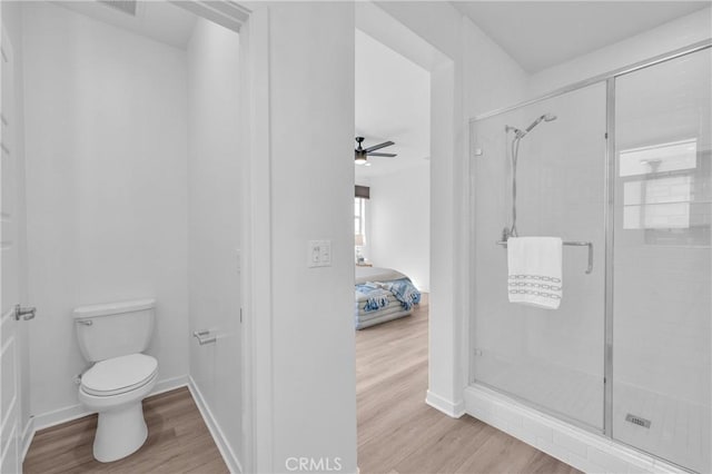 208 Harringay, Irvine, CA 92618 - bathroom featuring wood finished floors, a shower stall, connected bathroom, and ceiling fan