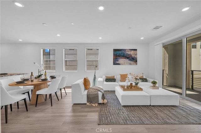 208 Harringay, Irvine, CA 92618 - living room featuring wood finished floors and recessed lighting