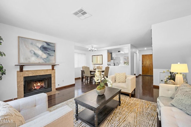 5036 Echo St Unit 37, Los Angeles, CA 90042 - living room with wood finished floors, a chandelier, a tile fireplace, and recessed lighting