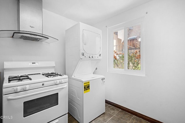 5036 Echo St Unit 37, Los Angeles, CA 90042 - kitchen with white range with gas stovetop, wall chimney range hood, stacked washer / dryer, and dark tile patterned floors